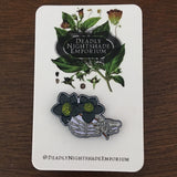 Skeleton holding Black Hellebore Enamel Pin